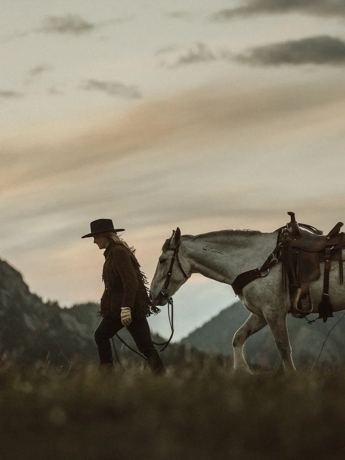 Rider walking with horse